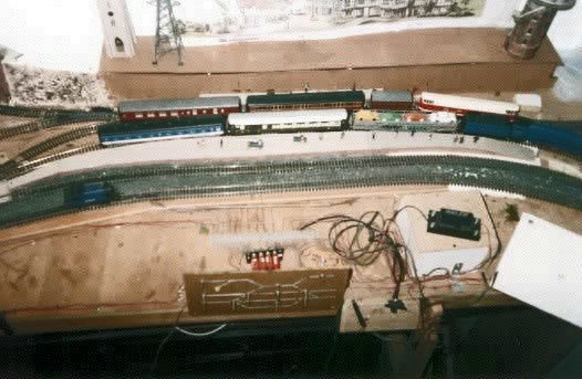 View of Hobbiton showing 'Nellie' (light-engine), No.15 'Elrond' (Mallard) hauling the motor-rail and a Shire passenger hauled by No.17 'Serrelind'.